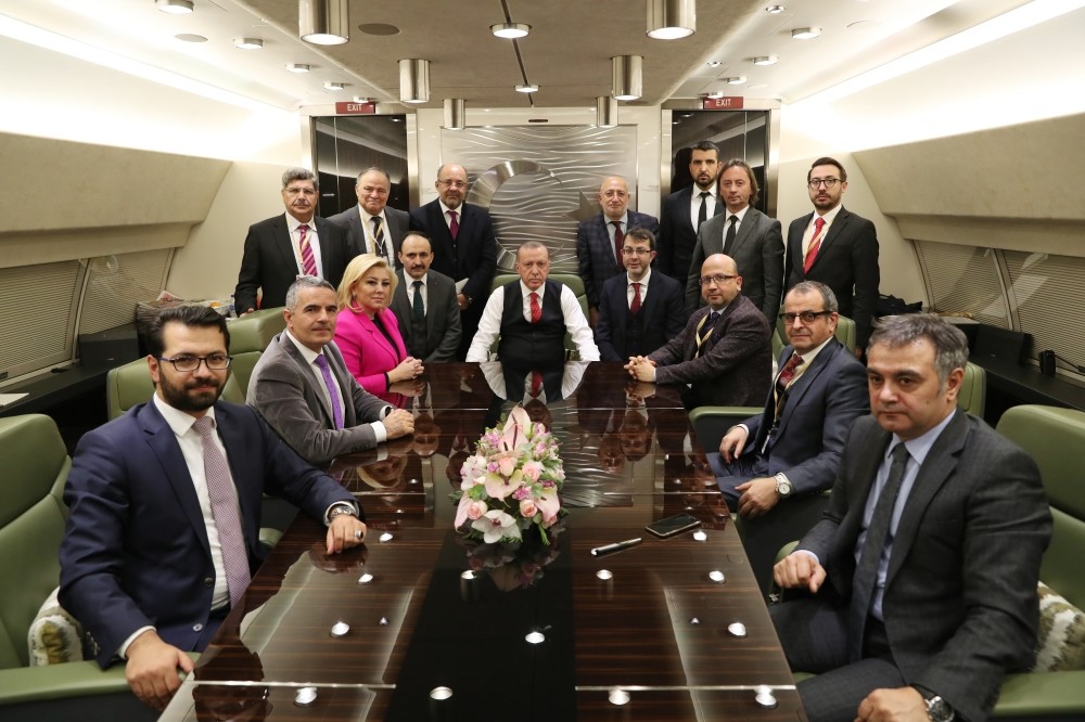 President Recep Tayyip Erdou011fan speaks with a group of journalists accompanying him during his visit to Moscow, Jan. 24, 2019.