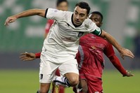 Qatari  Al-Sadd club player Xavi Hernandez (L) fights for the ball agianst Lekhwiyau2019s Ismail Mohammed during their Sheikh Jassim Cup final football match.