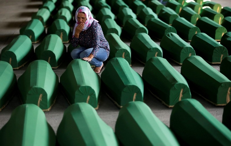 Muslim women cry near coffins of their relatives, who are newly identified victims of the 1995 Srebrenica massacre, which are lined up for a joint burial in Potocari near Srebrenica, Bosnia and Herzegovina July 9, 2016. (Reuters Photo)
