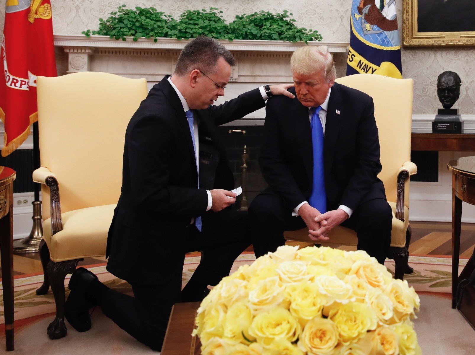 U.S. President Donald Trump prays with American pastor Andrew Brunson in the Oval Office of the White House, Saturday, Oct. 13, in Washington.