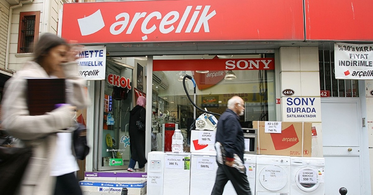 People walk past an Aru00e7elik dealer selling washing machines and refrigerators in Istanbul Oct. 12, 2011. (Reuters Photo)