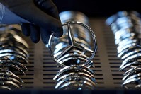 An employee of German car manufacturer Mercedes-Benz prepares the company's logo prior to its installation at the A-class production line at the Daimler factory in Rastatt, Germany, Feb. 4, 2019. (Reuters Photo)