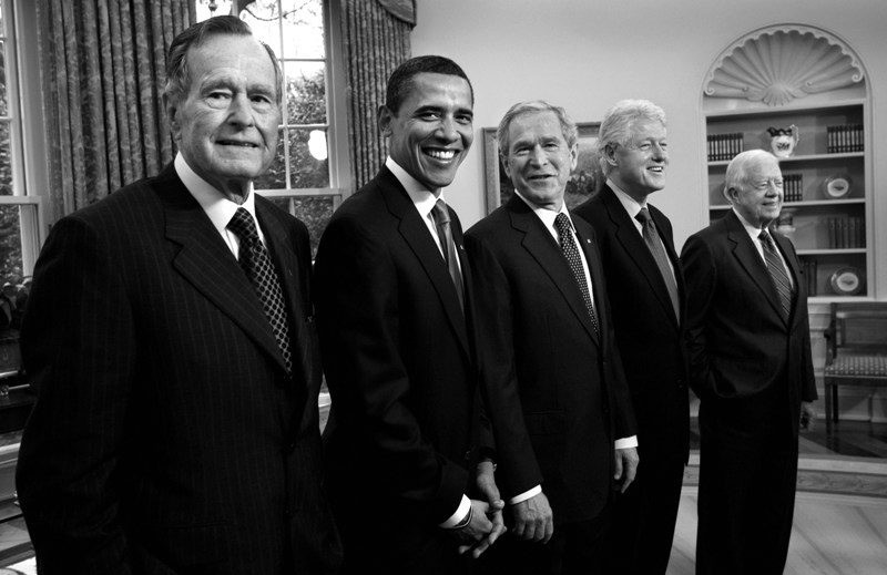 Former Presidents George H.W. Bush, Barack Obama, George W. Bush, Bill Clinton and Jimmy Carter in the Oval Office at the White House on Jan. 7, 2009. (Photo by David Hume Kennerly) 