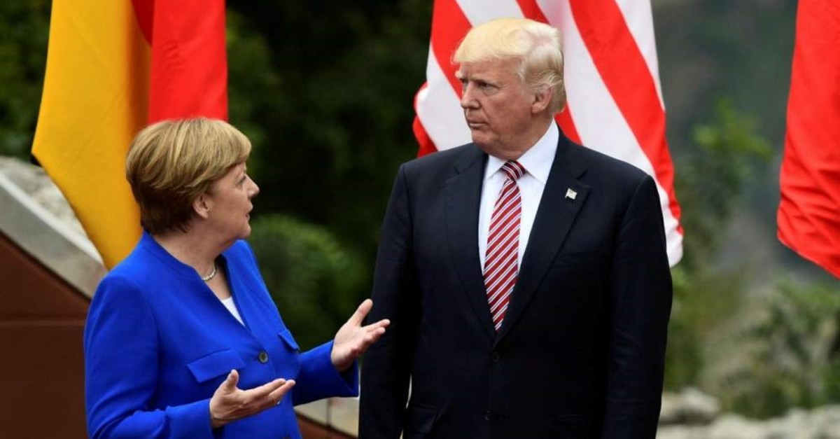 German Chancellor Angela Merkel (L) and U.S. President Donald Trump talks during the G7 summit in Taormina, Sicily, May 26, 2017. (AFP Photo)