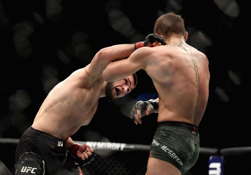 Khabib Nurmagomedov of Russia (L) punches Conor McGregor of Ireland in their UFC lightweight championship bout during the UFC 229 event inside T-Mobile Arena on October 6, 2018 in Las Vegas, Nevada. (AFP Photo)