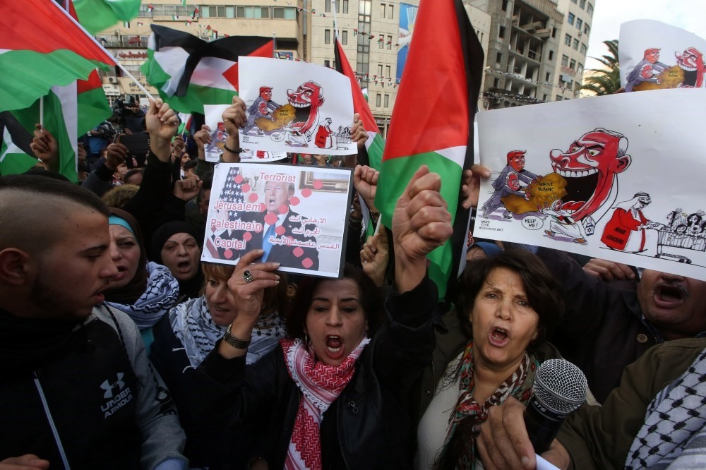 Palestinian protestors shout slogans against the U.S. during a protest  in Nablus, West Bank, Dec. 7.