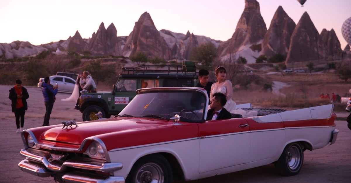 Classic cars add a magical atmosphere to Cappadocia's landscape.