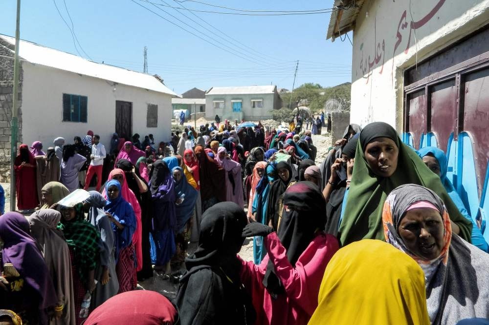 People wait in a line to cast their votes in the presidential election at a polling station in Hargeisa, Somaliland, Nov. 13. 