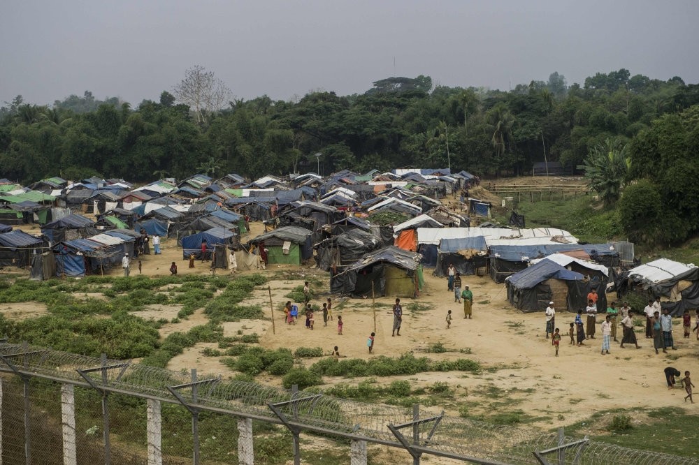 Rohingya refugees gather near their shelters in ,no man's land, behind Myanmar's border lined with barb wire fences, Rakhine state, April 25.