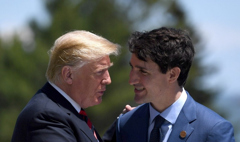 Trump (L) meets Canada's Prime Minister Justin Trudeau (R) at the Welcome Ceremony at the G7 summit in Charlevoix in Canada June 8, 2018. (EPA Photo)