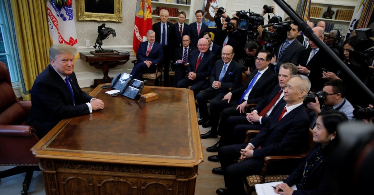 U.S. President Donald Trump meets with Chinese Vice Premier Liu He (R) in the Oval Office at the White House in Washington, U.S., Feb. 22, 2019.
