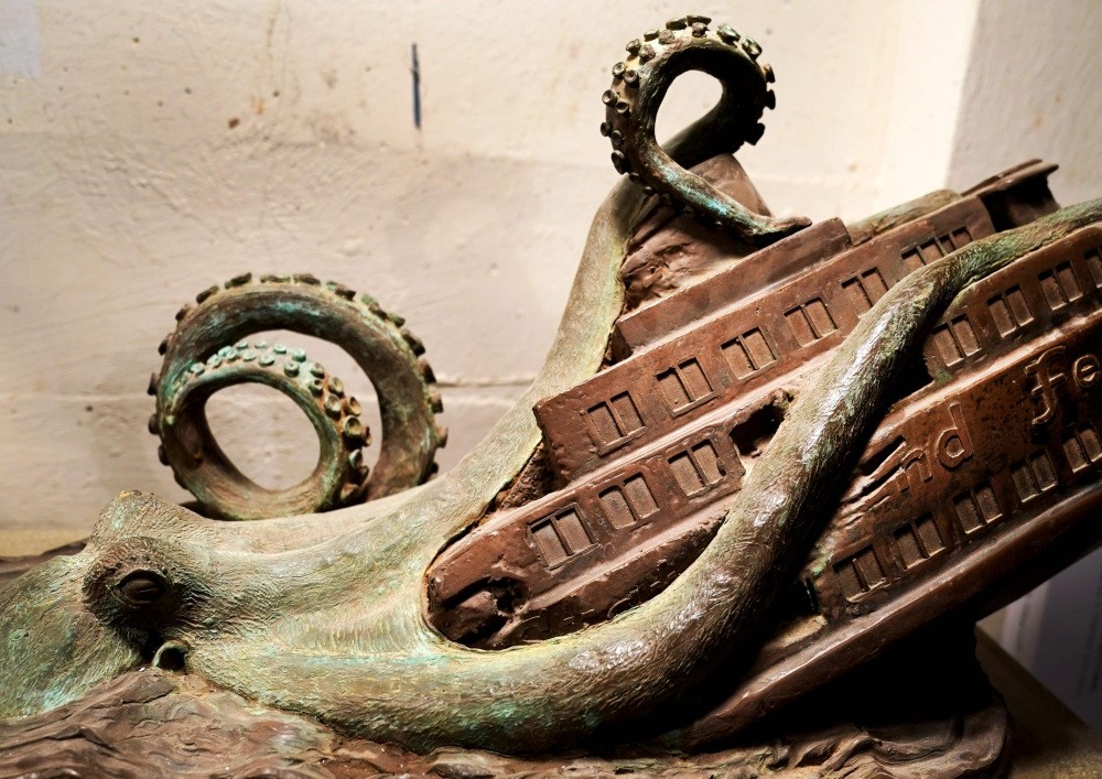 Sculpture by artist Joseph Reginella depicts the Staten Island Ferry Octopus Disaster of 1963, during which one of the boroughu2019s famous orange boats was dragged below the East Riveru2019s surface by an enormous, tentacled beast.