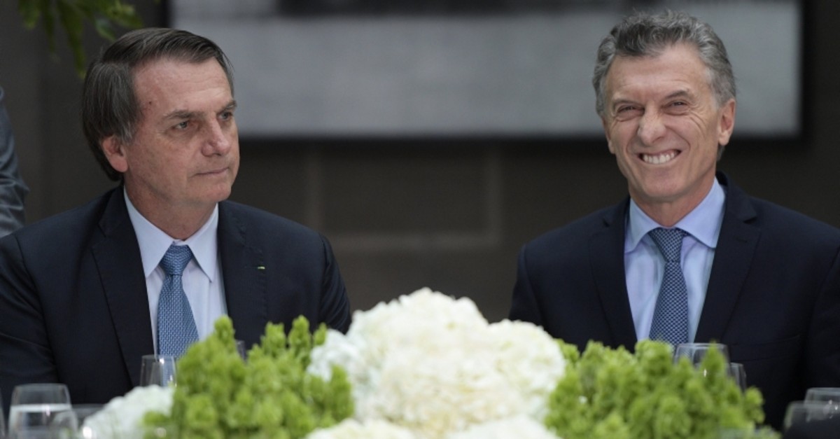 Brazil's President Jair Bolsonaro, left, and Argentina's President Mauricio Macri are pictured during a lunch at the government house in Buenos Aires, Argentina, Thursday, June 6, 2019.(AFP Photo)