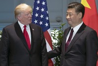 The President Trump (L) and Chinese President Xi arrive for a meeting on the sidelines of the G20 Summit in Hamburg, July 8.