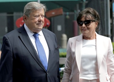 Viktor and Amalija Knavs listen as their attorney makes a statement in New York, Thursday, Aug. 9, 2018. (AP Photo)