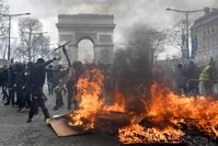 Yellow vest protesters face police forces as clashes erupt at the Champs Elysees, Paris, March 16, 2019. (EPA Photo)