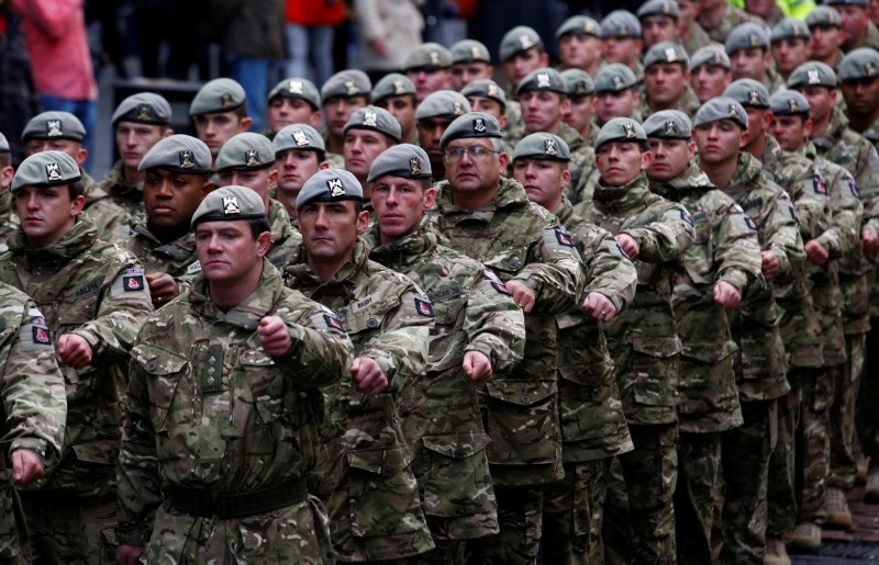 Soldiers of the British Army's Royal Scots Dragoon Guards regiment march down the Royal Mile to mark their return from a tour of duty in Helmand Province in Afghanistan, during a Homecoming parade in Edinburgh, Scotland, Dec. 1, 2011. (Reuters Photo)