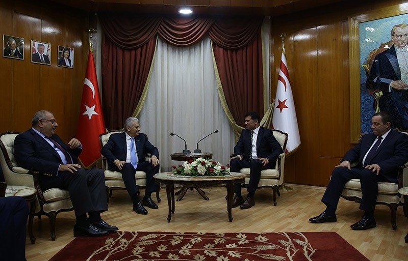 Turkey's PM Binali Yu0131ldu0131ru0131m (2nd left) meets with his Turkish Cypriot counterpart Hu00fcseyin u00d6zgu00fcrgu00fcn in the Turkish Republic of Northern Cyprus (TRNC) on March 9, 2017. (AA Photo)