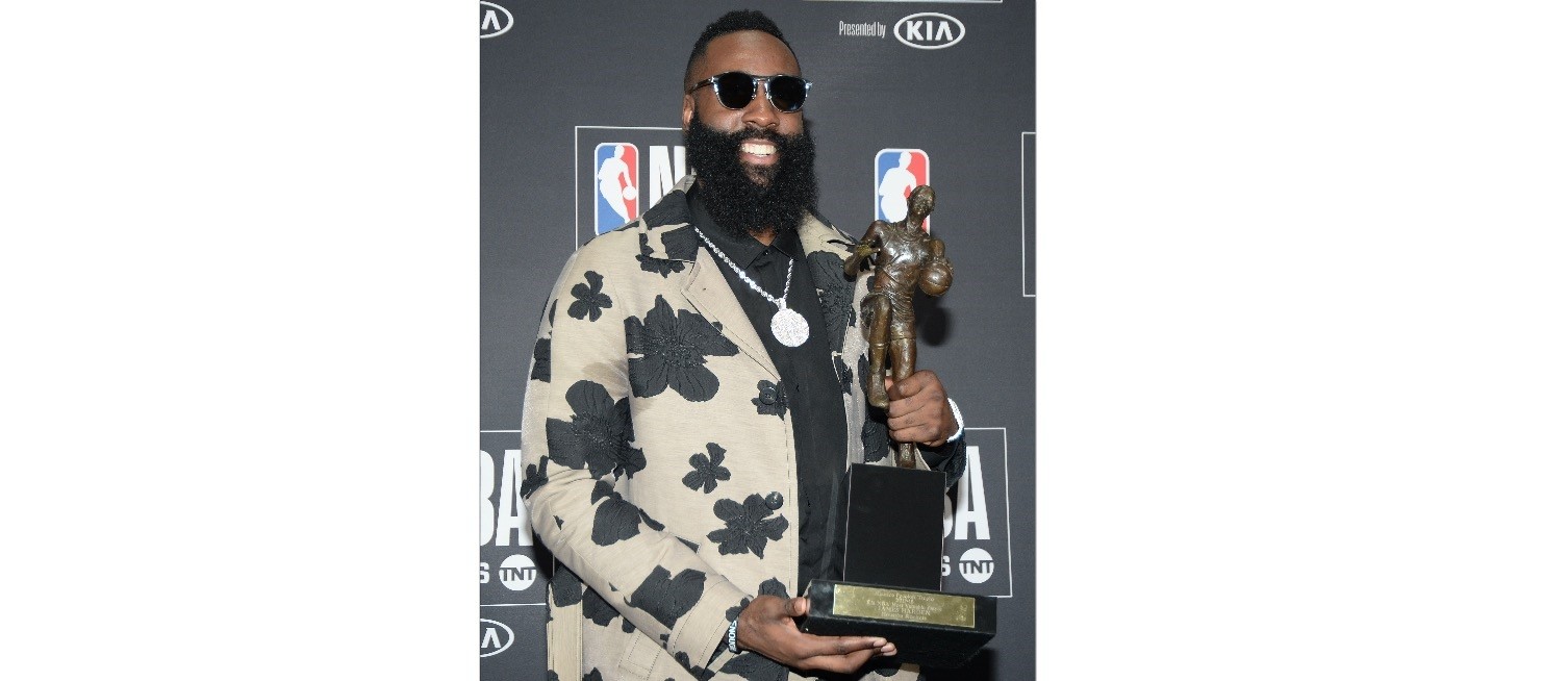 Houston Rockets guard James Harden poses for photos with his MVP award during the NBA Award Show at Barker Hanger, June 25.