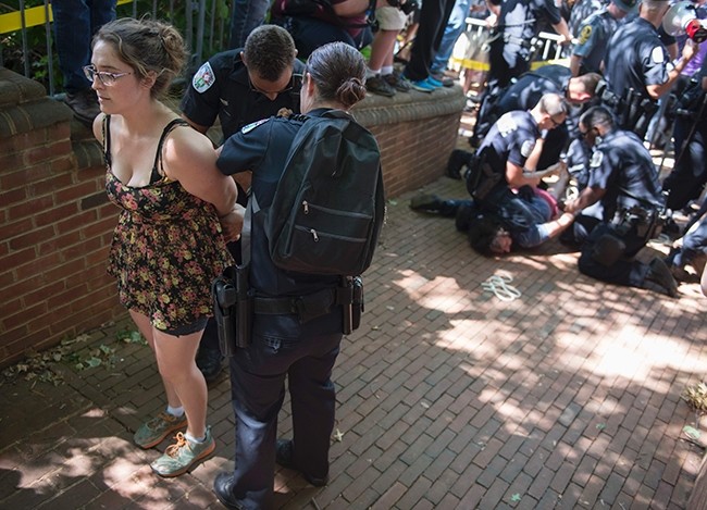 Protesters are arrested before members of the Ku Klux Klan arrive for a rally in Charlottesville, Virginia on July 8, 2017. (AFP Photo)