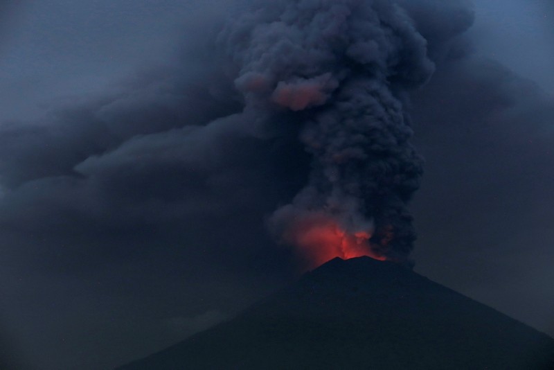 Glowing light of hot lava is seen during the eruption of Mount Agung as seen from Amed in Karangasem, Bali, Indonesia (Reuters File Photo)