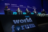 Robert Dickson Crane (second L), Professor u015eu00fckru00fc Haniou011flu of Princeton University (C), analyst Thomas Barrett (R) and Professor William Hale of SOAS University of London (second R) attends a panel moderated by TRT World presenter Ghida Fakhry (L).