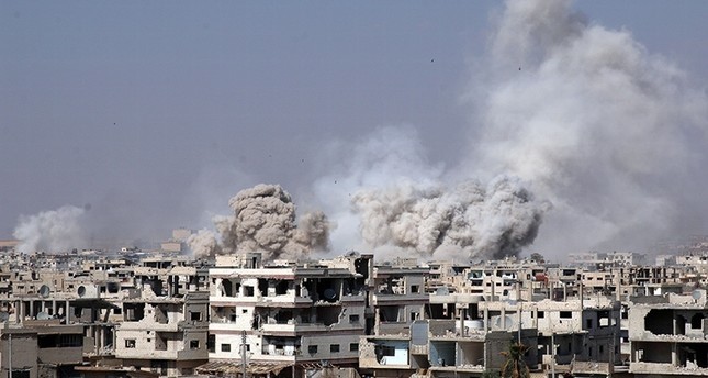 Smoke rises after shelling on an opposition-held area of Deraa, Syria, June 4, 2017 (Reuters Photo)