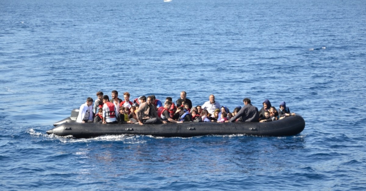 A group of illegal Afghan migrants aboard a boat off the coast of Ayvacu0131k in western Turkey, Oct. 15, 2019. (DHA Photo)