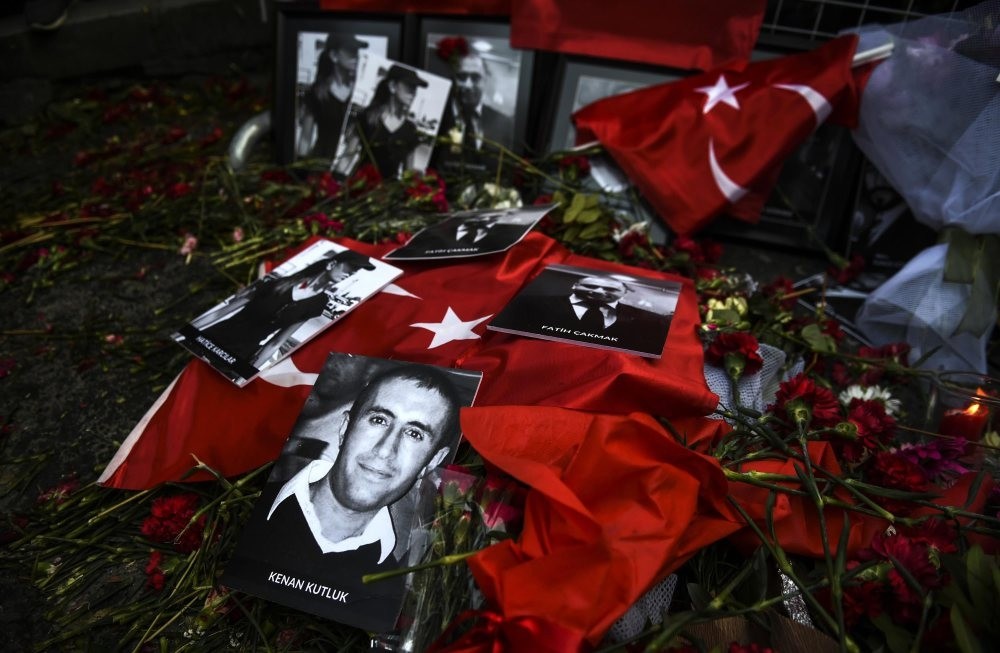 Pictures of victims lie on flowers and flags in front of the Reina nightclub where a Daesh attack killed 39 people during New Year celebrations last year.