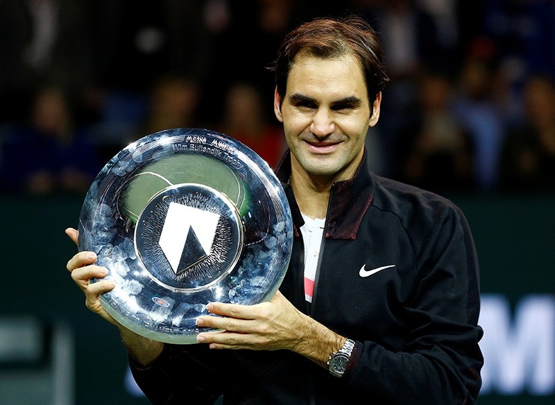 Roger Federer of Switzerland holds the trophy after winning against Grigor Dimitrov of Bulgaria. (Reuters Photo)
