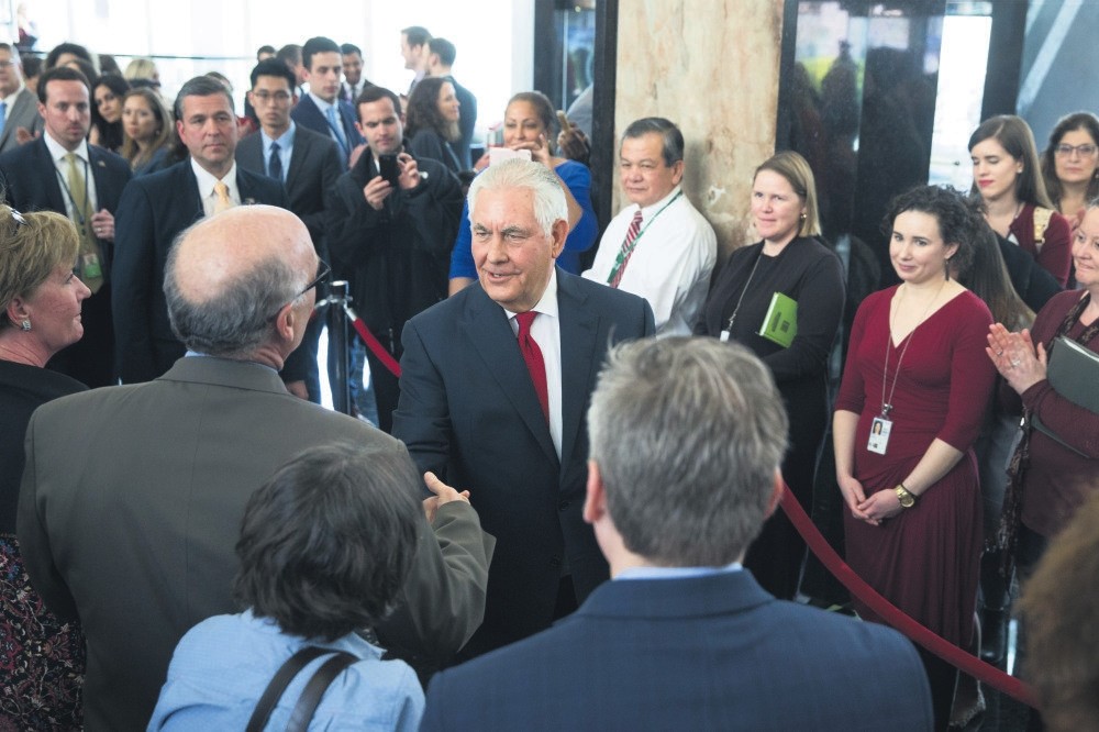 Former U.S. Secretary of State Rex Tillerson (C) greets State Department employees after President Trump replaced him with CIA Director Mike Pompeo with a tweet he posted on his Twitter account. Washington, March 22. 