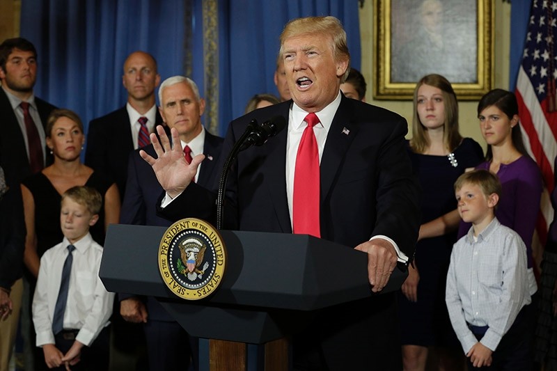 U.S. President Donald Trump delivers s statement on healthcare in front of alleged ,victims of Obamacare, at the White House in Washington on July 24, 2017. (AFP Photo)