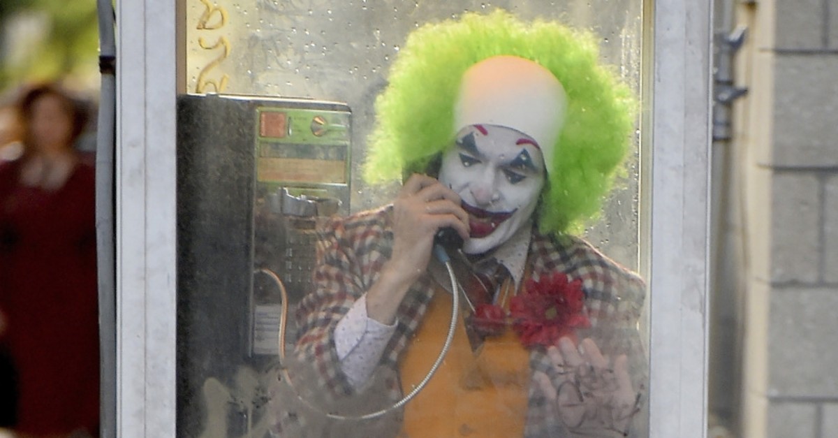 Joaquin Phoenix films ,Joker, in a telephone booth in Brooklyn, New York.