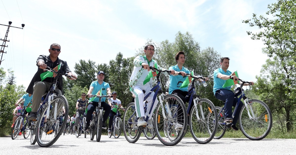 Cyclists tour around Eymir Lake, June 3, 2019.