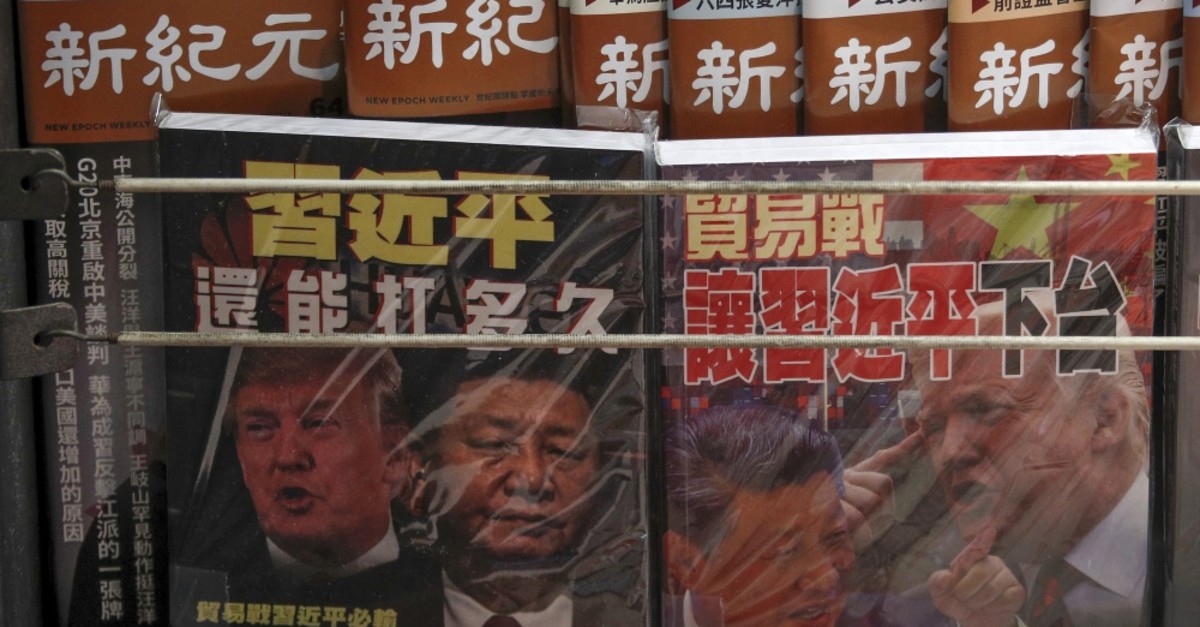 Chinese magazines featuring China's President Xi Jinping and U.S. President Donald Trump on the trade war on sale at a roadside newsstand in Hong Kong, July 4, 2019.