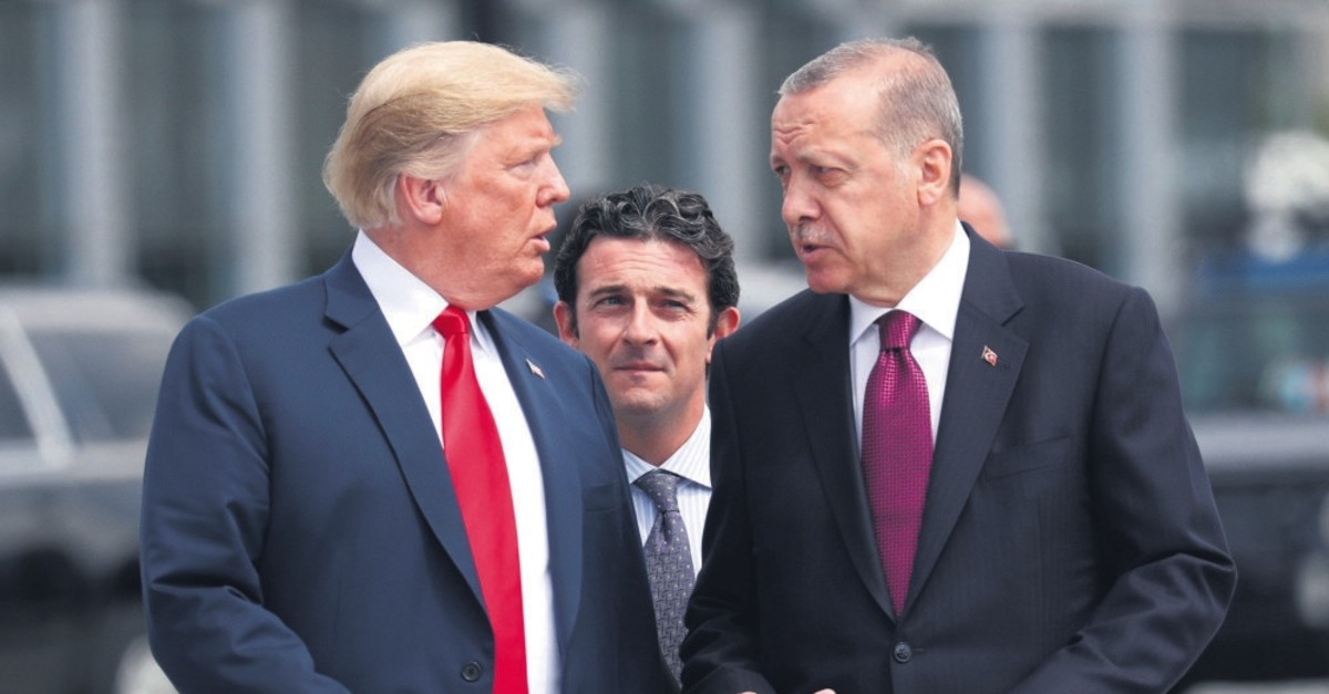 President Recep Tayyip Erdou011fan and U.S. President Donald Trump (L) gesture as they talk at the start of the NATO summit, Brussels, Belgium, July 11, 2018.
