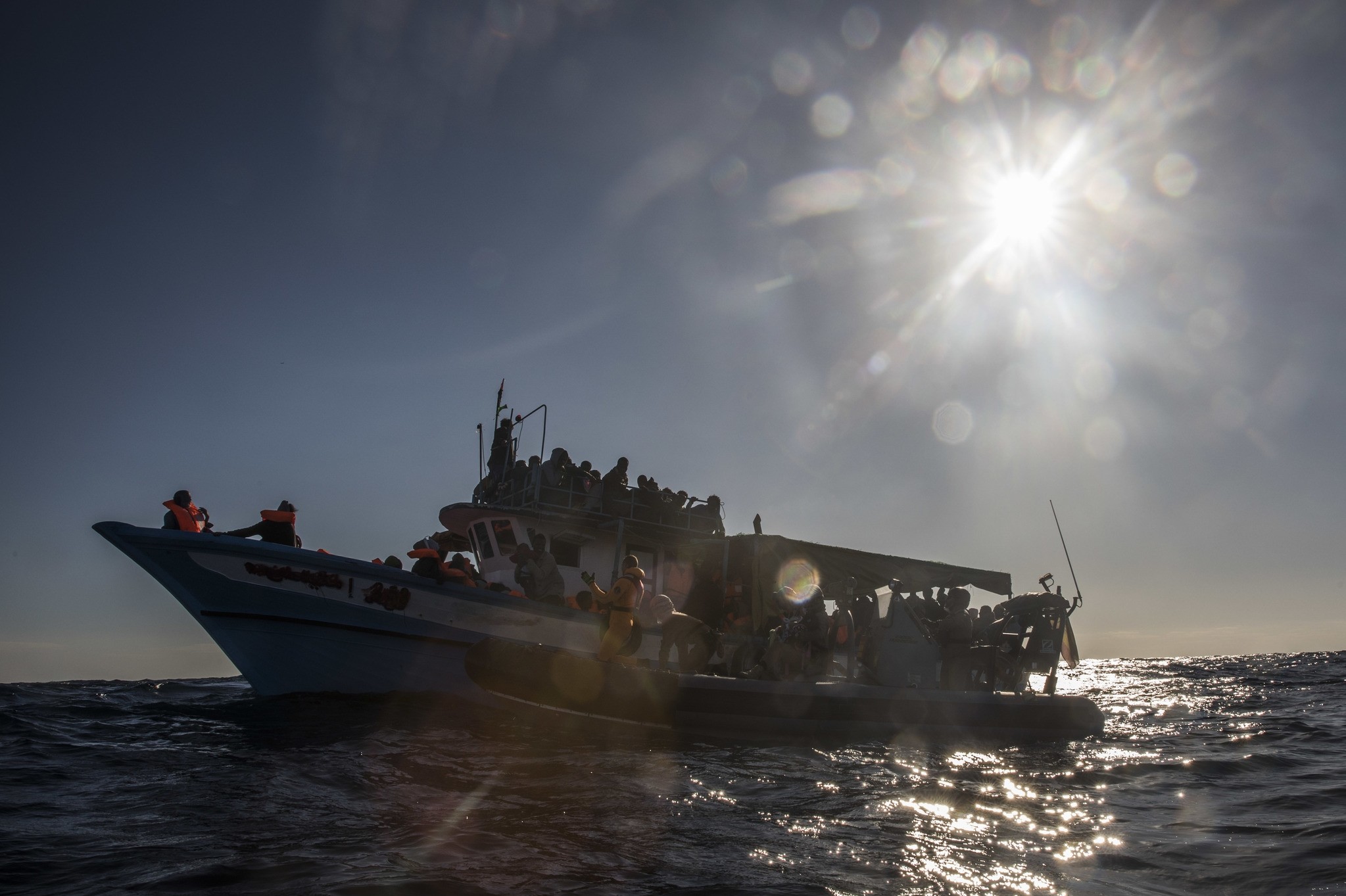 In this Saturday Jan. 27, 2018, photo shows 329 refugees and migrants trying to reach European soil aboard an overcrowded wooden boat, 45 miles north of Al-Khums, Libya. (AP Photo)