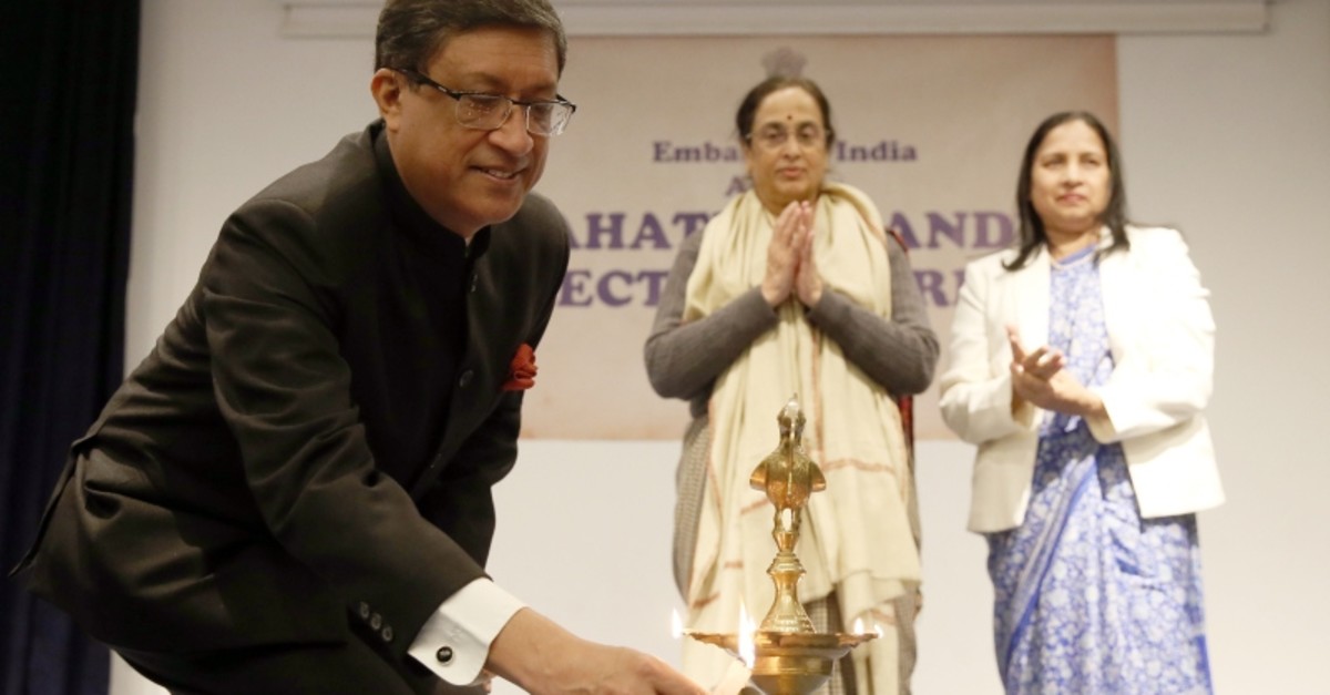 India's Ambassador to Ankara Sanjay Bhattacharyya lights a candle in remembrance of Mahatma Gandhi on his 150th birth anniversary. (AA Photo)