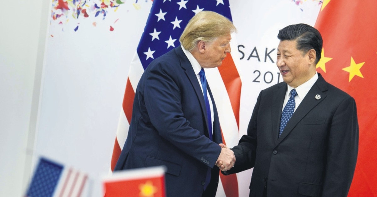 China's President Xi Jinping greets U.S. President Donald Trump before a bilateral meeting on the sidelines of the G20 summit in Osaka, June 28, 2019.
