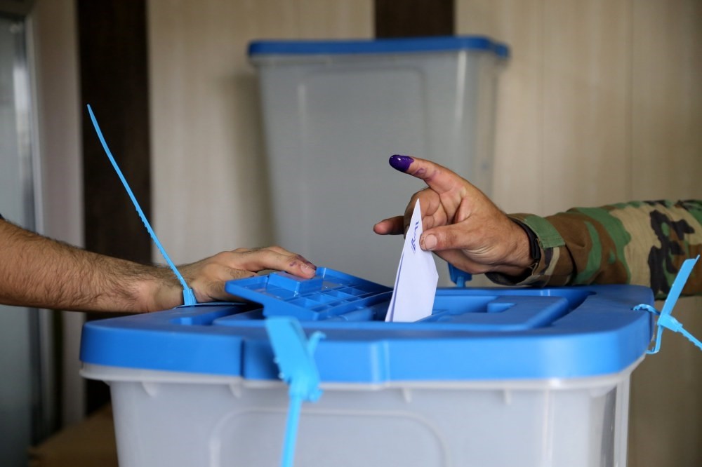 A Kurdish peshmerga soldier votes during the Iraqi Kurdistan independence referendum in Irbil on Sept. 25.