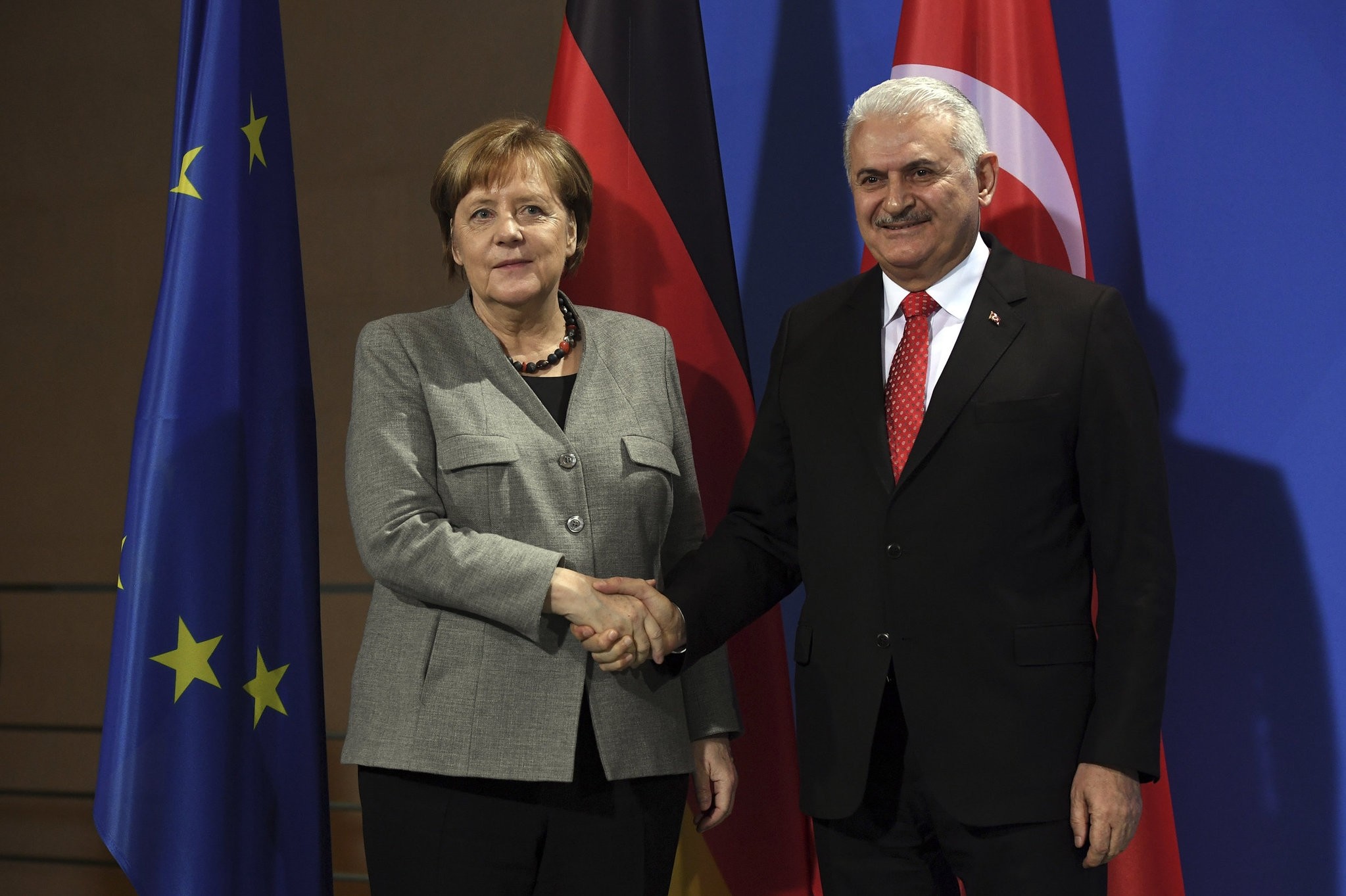 German Chancellor Merkel and Prime Minister Yu0131ldu0131ru0131m shake hands during a press conference in the Chancellery, Berlin, Feb. 15. 