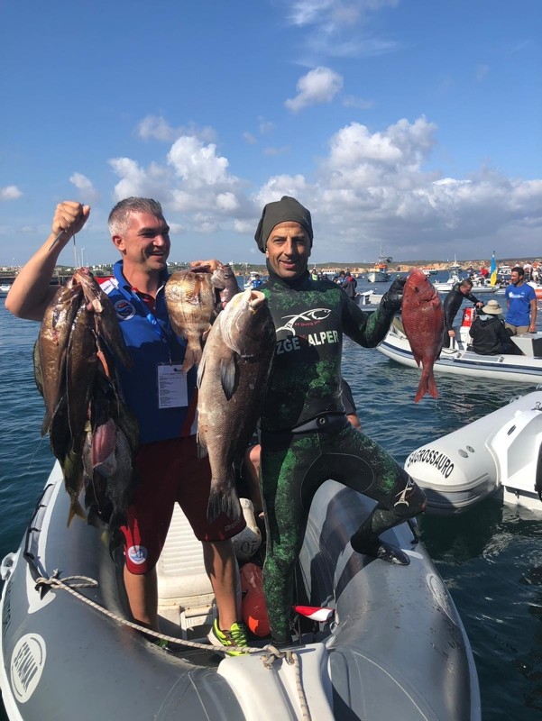 Turkish atlete Ahmet Tekin (R) poses with his catch u2014 a 7-kilo Rubberlip Grunt in Portugal. (AA Photo) 