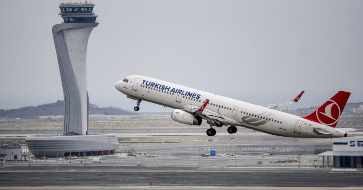 A Turkish Airlines plane takes off in front of the control tower at Istanbul Airport on the first day after moving from Ataturk International airport on April 6, 2019 in Istanbul. (AFP Photo)