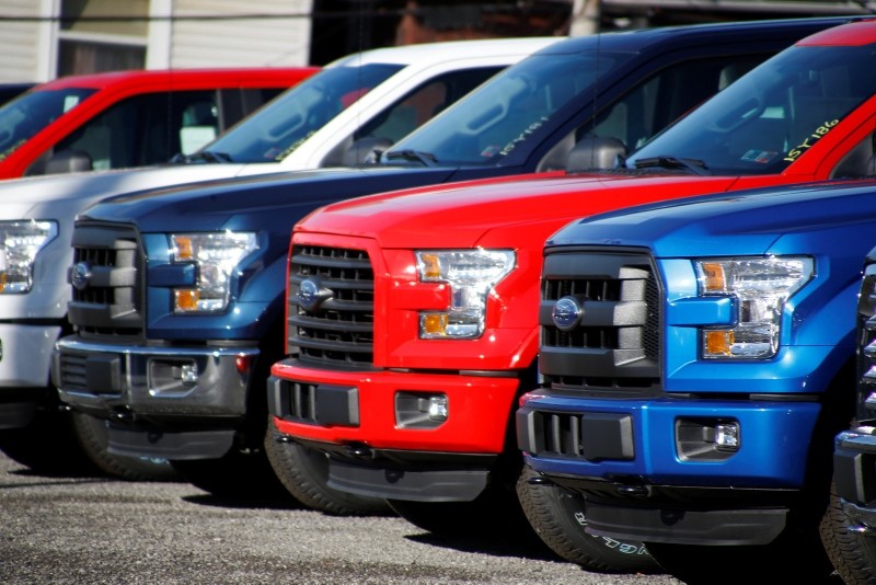 In this Nov. 19, 2015, file photo a row of 2015 Ford F-150 pickup trucks are parked on the sales lot at Butler County Ford in Butler, PA, U.S. (AP Photo)