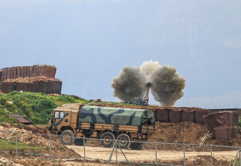 This file photo dated March 1, 2018 shows a Turkish howitzer deployed in southern Hatay province firing at YPG positions during the Operation Olive Branch. (AA Photo)