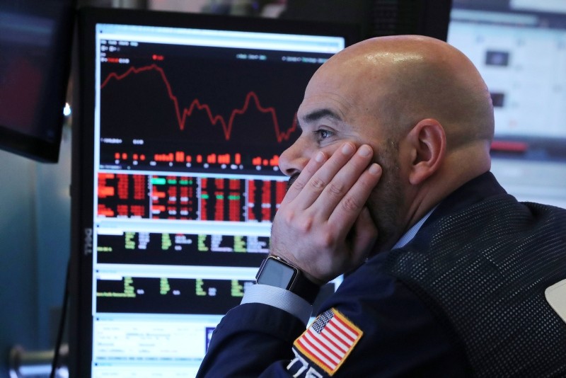 This Dec. 4, 2018 file photo shows a trader working on the floor at the New York Stock Exchange (NYSE) in New York. (Reuters Photo)