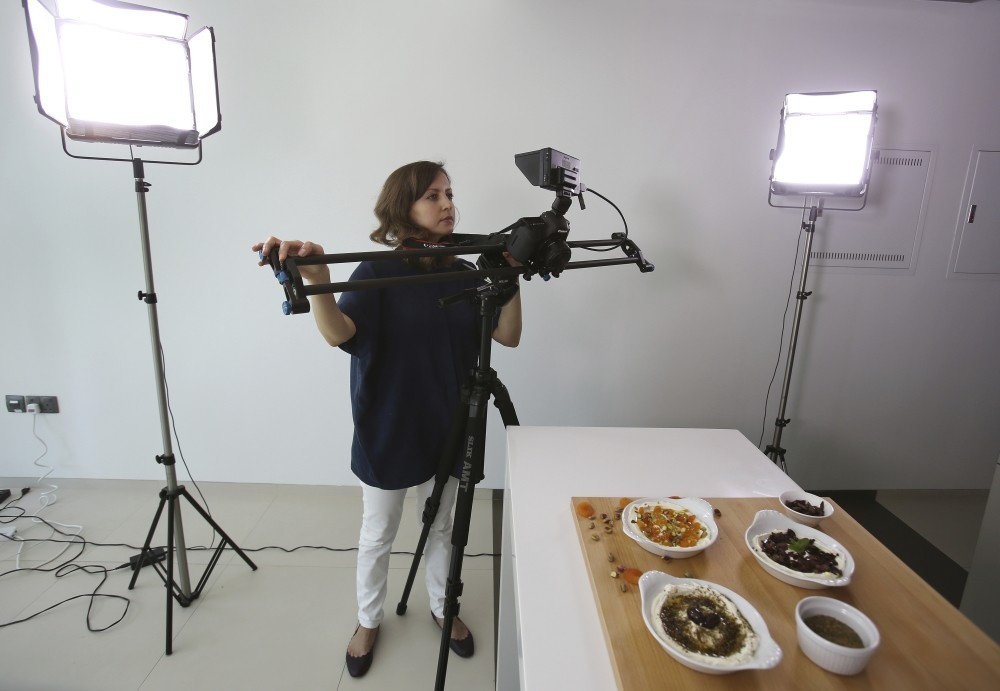 Alia Adi, founder of the YouTube cooking channel Basmaty World, works in her studio in Dubai, United Arab Emirates. 