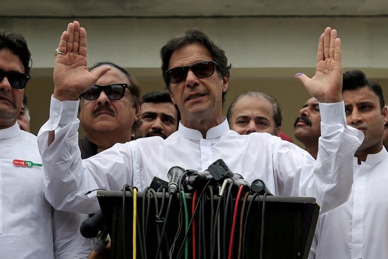 This file photo shows Imran Khan, chairman of Pakistan Tehreek-e-Insaf (PTI), speaks to members of media after casting his vote at a polling station during the general election in Islamabad, Pakistan, July 25, 2018. (Reuters Photo)