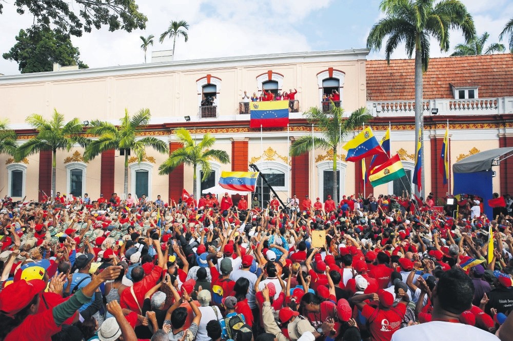 Venezuelau2019s President Nicolas Maduro speaks to his supporters from a balcony after a coup attempt against him, Caracas, Venezuela, Jan. 23, 2019.
