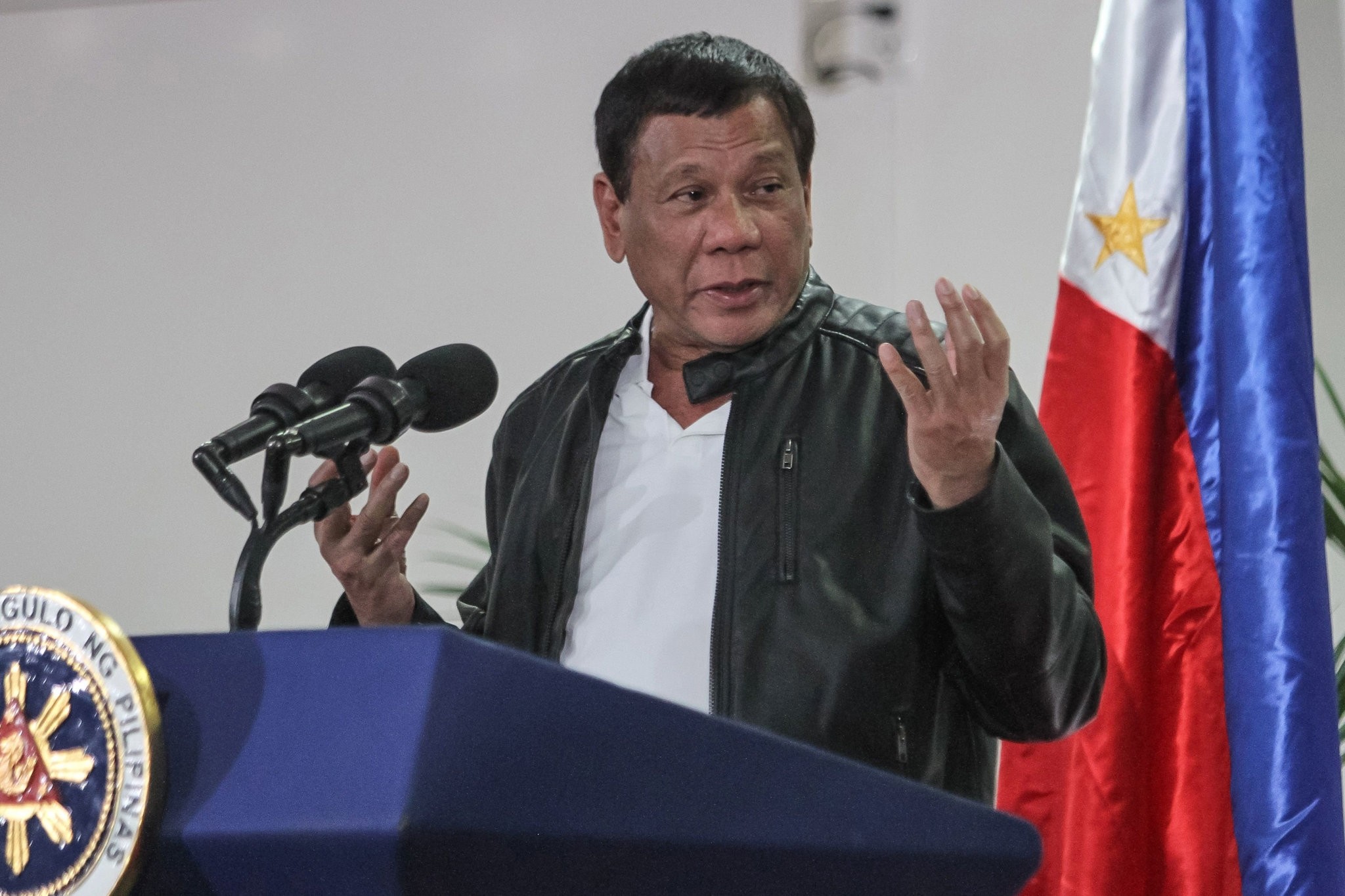 Philippine President Rodrigo Duterte gestures as he speaks shortly after arriving in Davao on May 16, 2017, from a working visit to China. (AFP Photo)